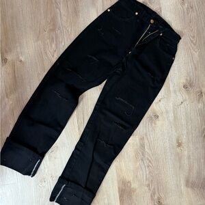 Distressed black wrangler jeans